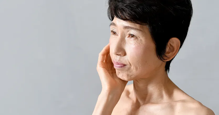 Woman with hand on face